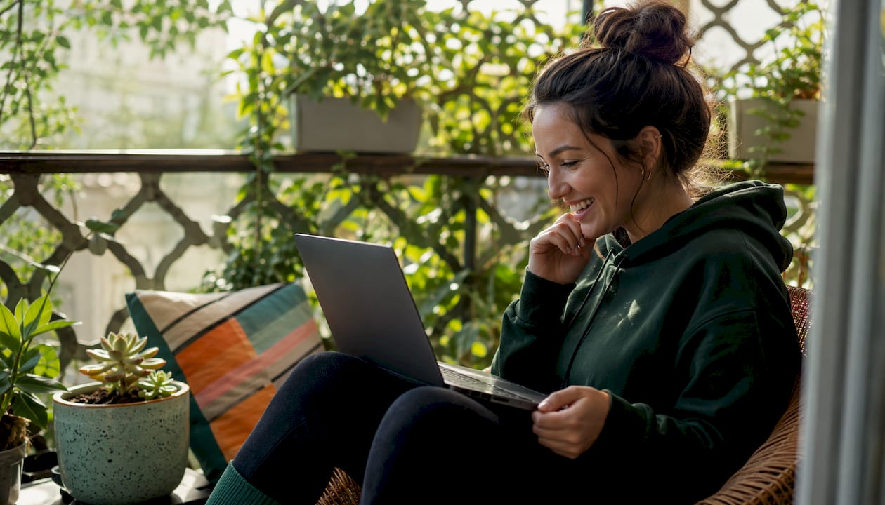 Woman watching geography video clips at home